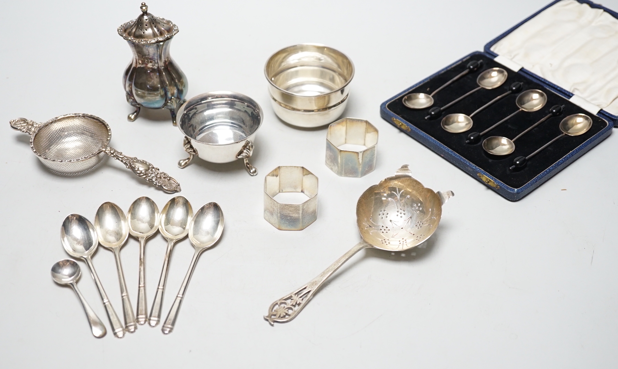 Sundry small silver including condiments, napkin rings and flatware.